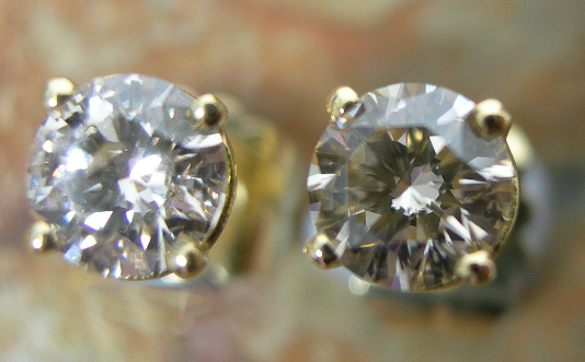 A pair of 18ct yellow gold mounted diamond set earrings,