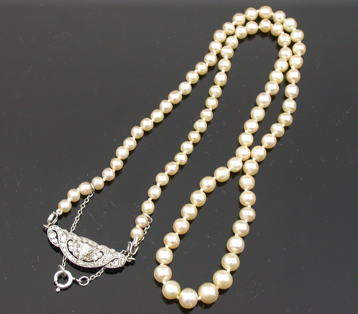 A cultured pearl necklace with diamond set clasp,