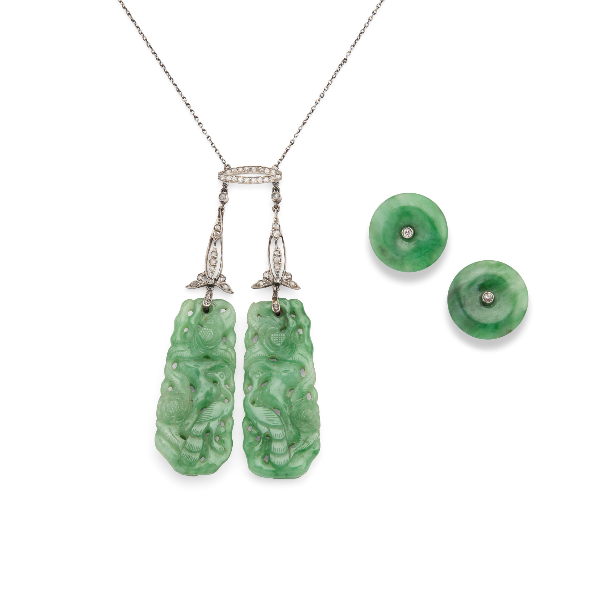 An early 20th century carved jade and diamond pendant necklace and earrings