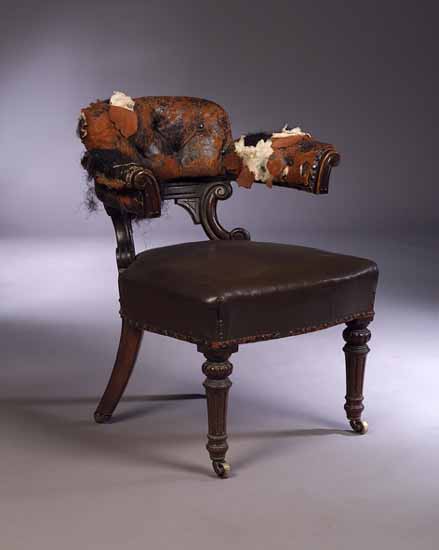 An early Victorian mahogany library armchair