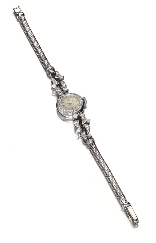 OMEGA - a lady's platinum mounted diamond cocktail watch,