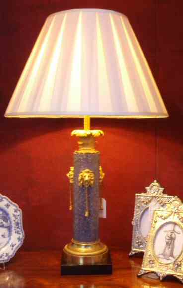 A pair of Louis XVI style marble and gilt bronze mounted lamps
