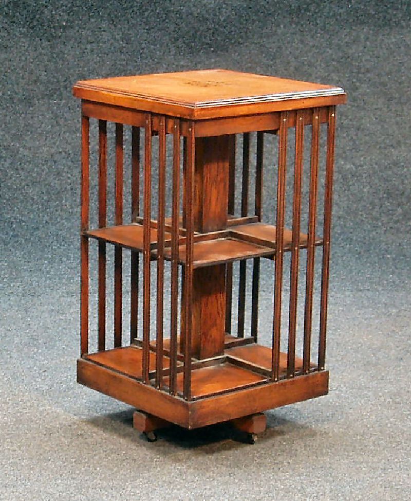 An Edwardian elm revolving bookcase