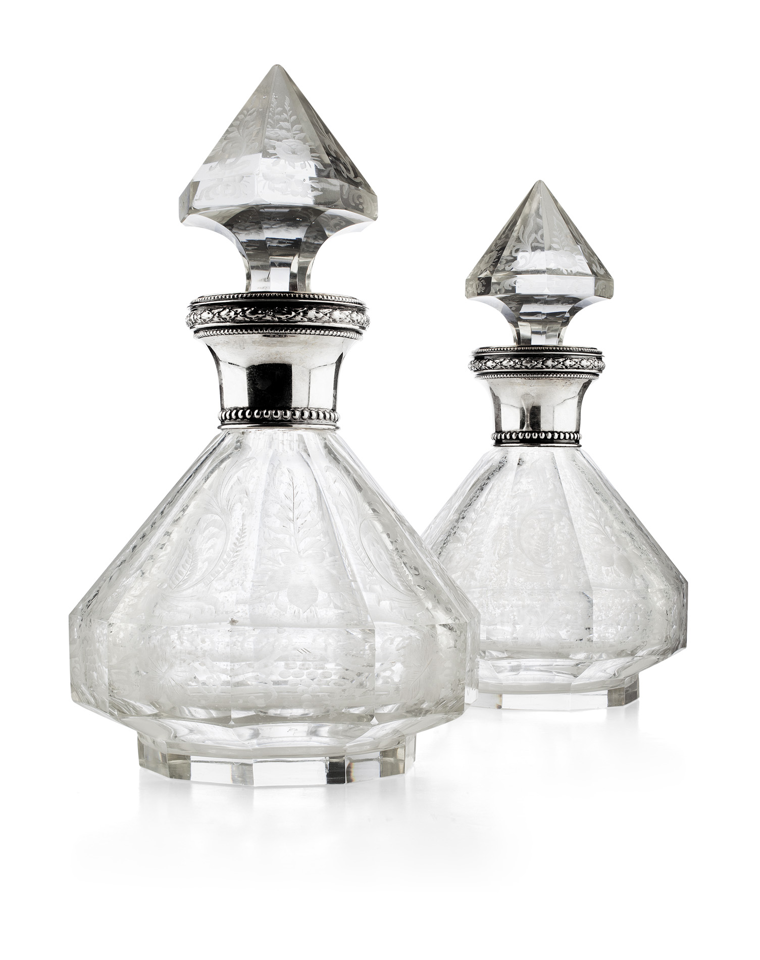 PAIR OF CONTINENTAL SILVER MOUNTED DECANTERS