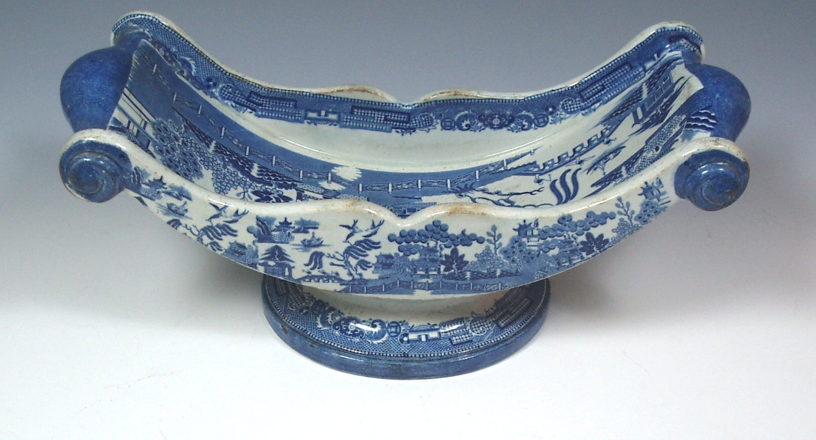 A Clew's blue and white willow pattern cheese wedge,