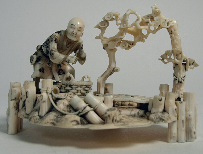 A Japanese ivory okimono of a fisherman, Meiji period