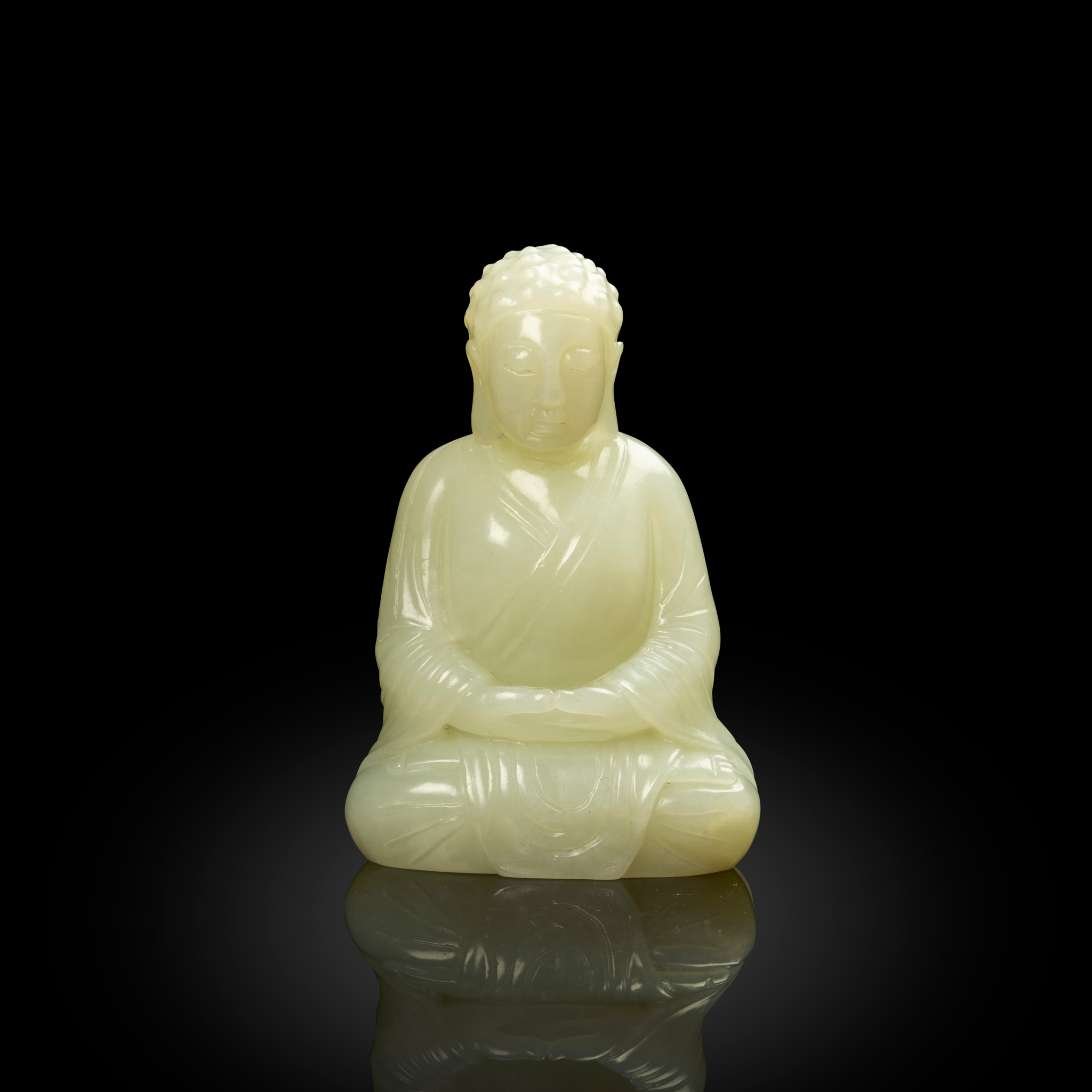 CHINESE WHITE JADE CARVING OF A SEATED BUDDHA