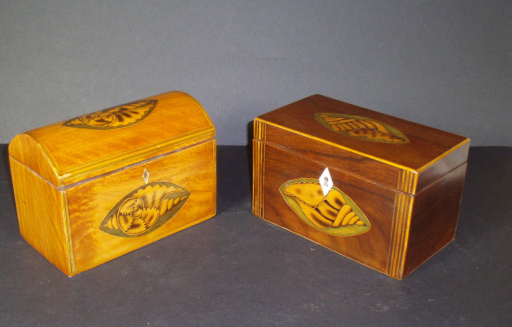 A Georgian style inlaid mahogany tea caddy