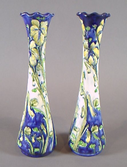 A pair of Florian Ware tapering cylindrical vases