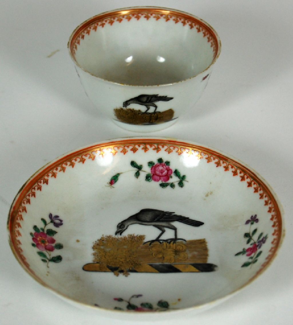 CHINESE EXPORT ARMORIAL TEA BOWL AND SAUCER