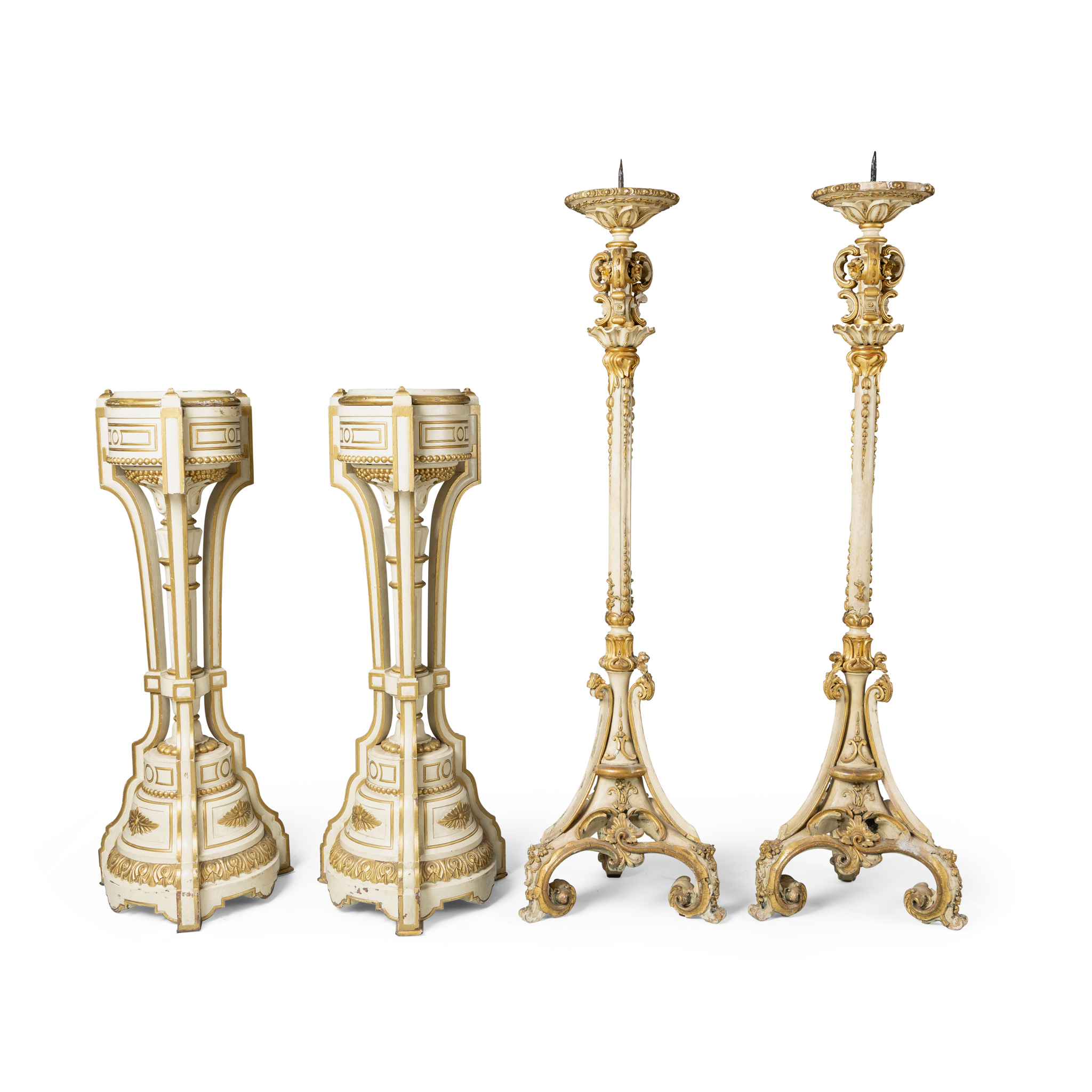 A PAIR OF CREAM PAINTED AND GILT DECORATED OVERSIZE PRICKET CANDLESTICKS