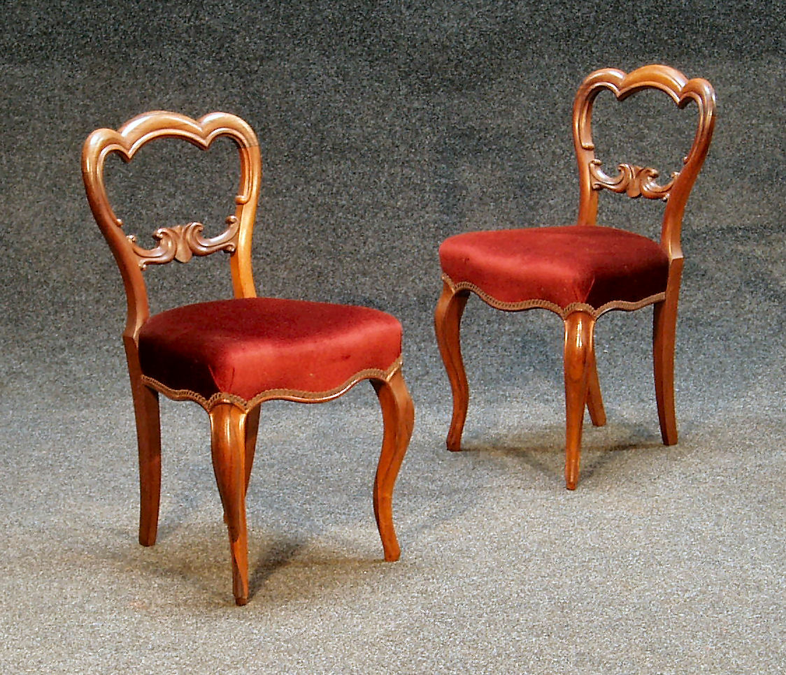 A set of six Victorian rosewood balloon back chairs,