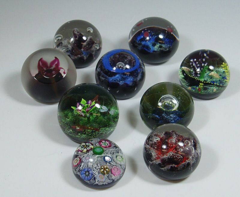 A collection of Scottish Art glass paperweights, including limited editions