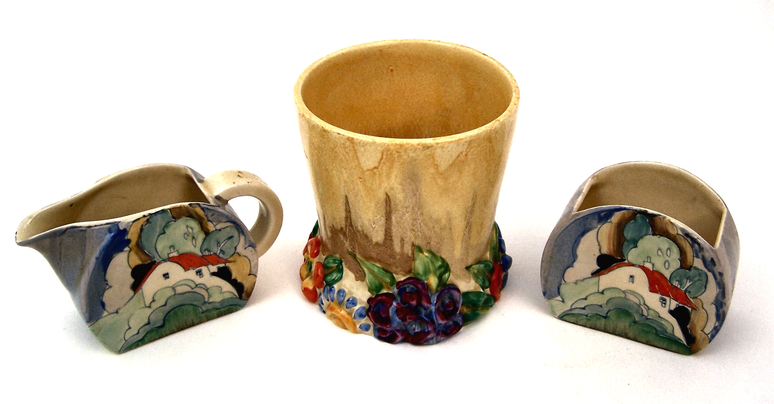 A Clarice Cliff sugar bowl and cream jug,