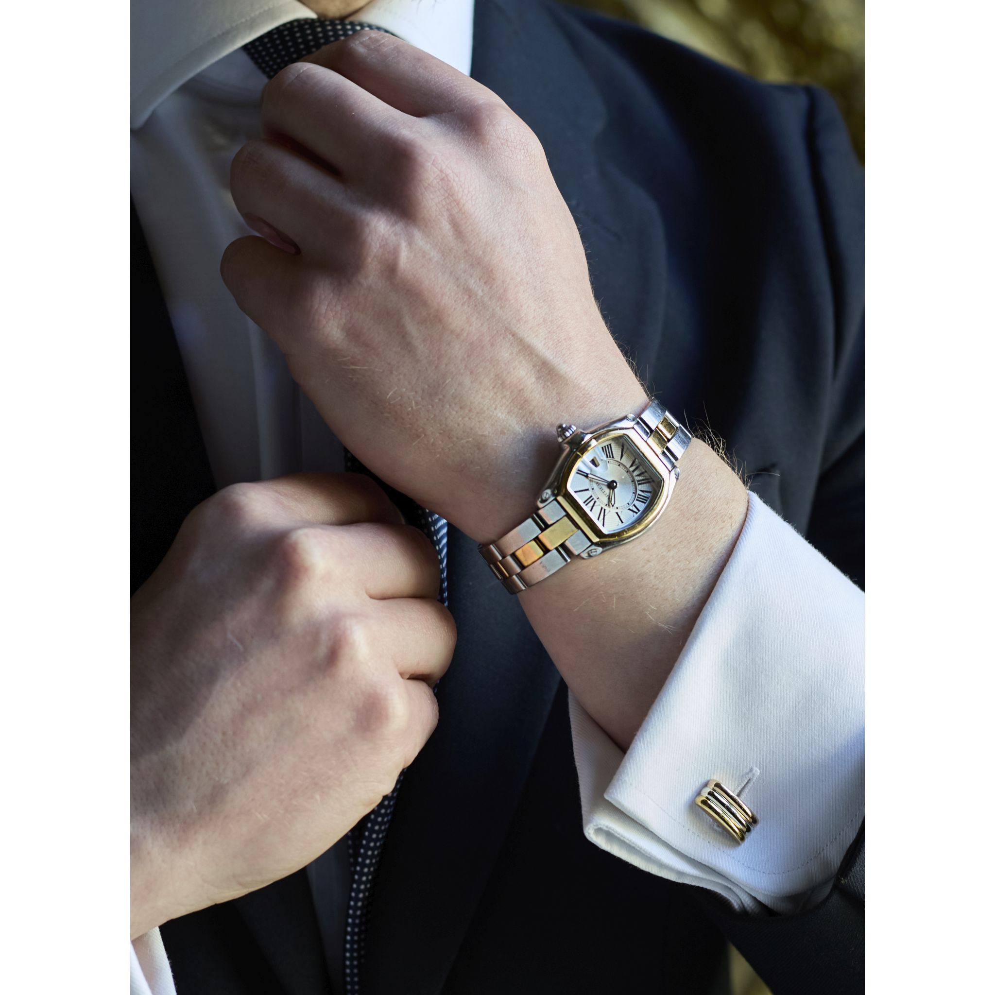 Cartier: A stainless steel and gold tonneau shape quartz wristwatch with date