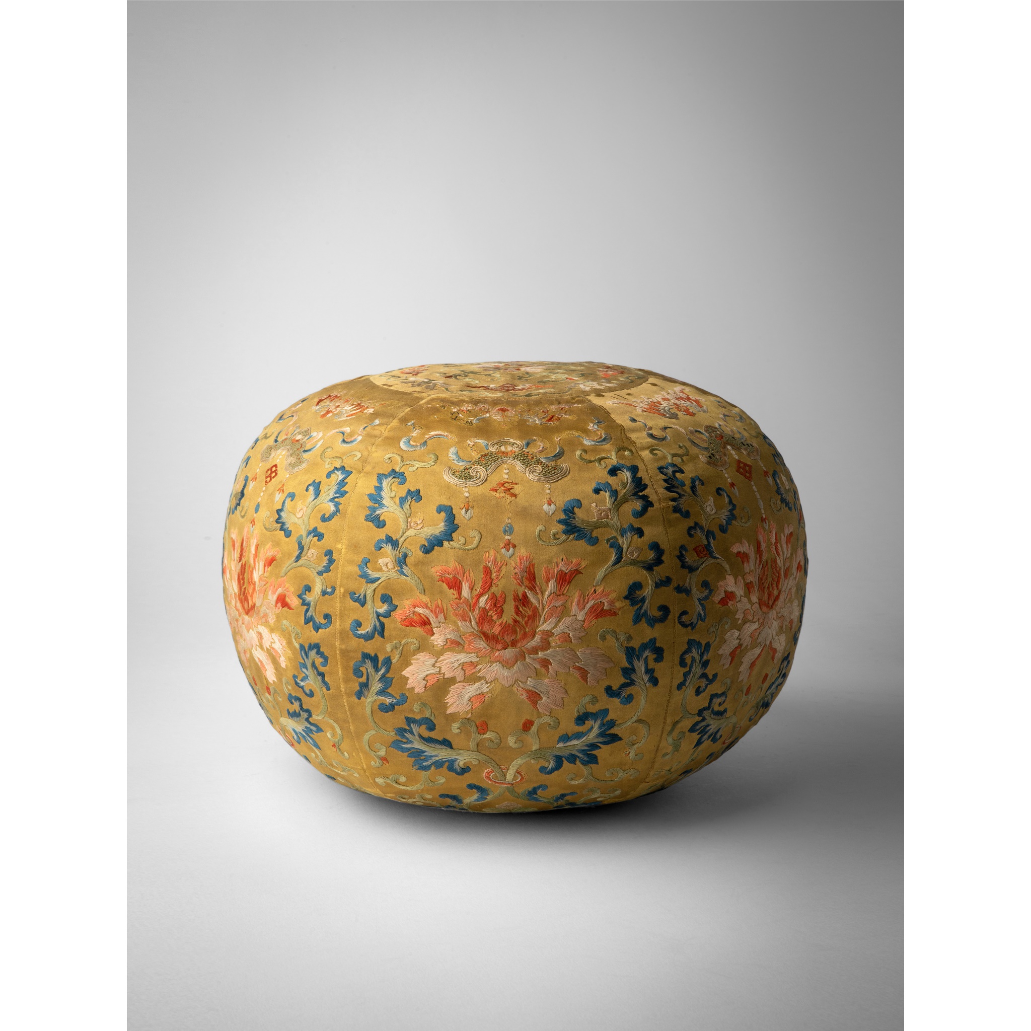 YELLOW-GROUND EMBROIDERED SILK 'LOTUS' SPHERICAL ELBOW CUSHION