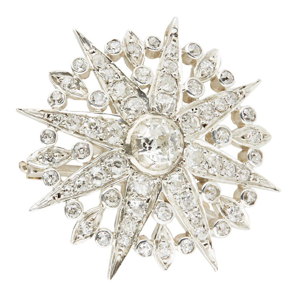 A diamond set star brooch