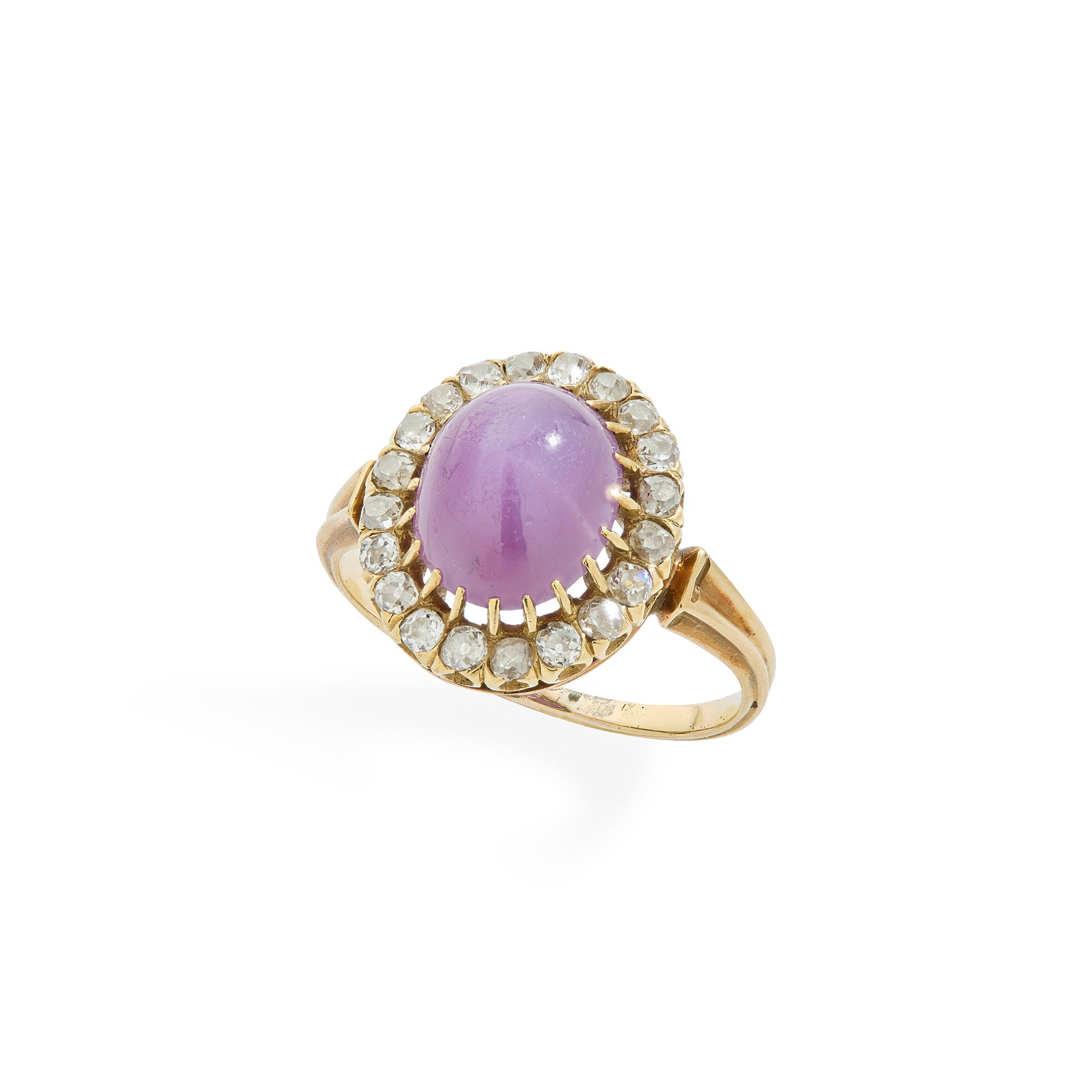 An early 20th century star ruby and diamond cluster ring