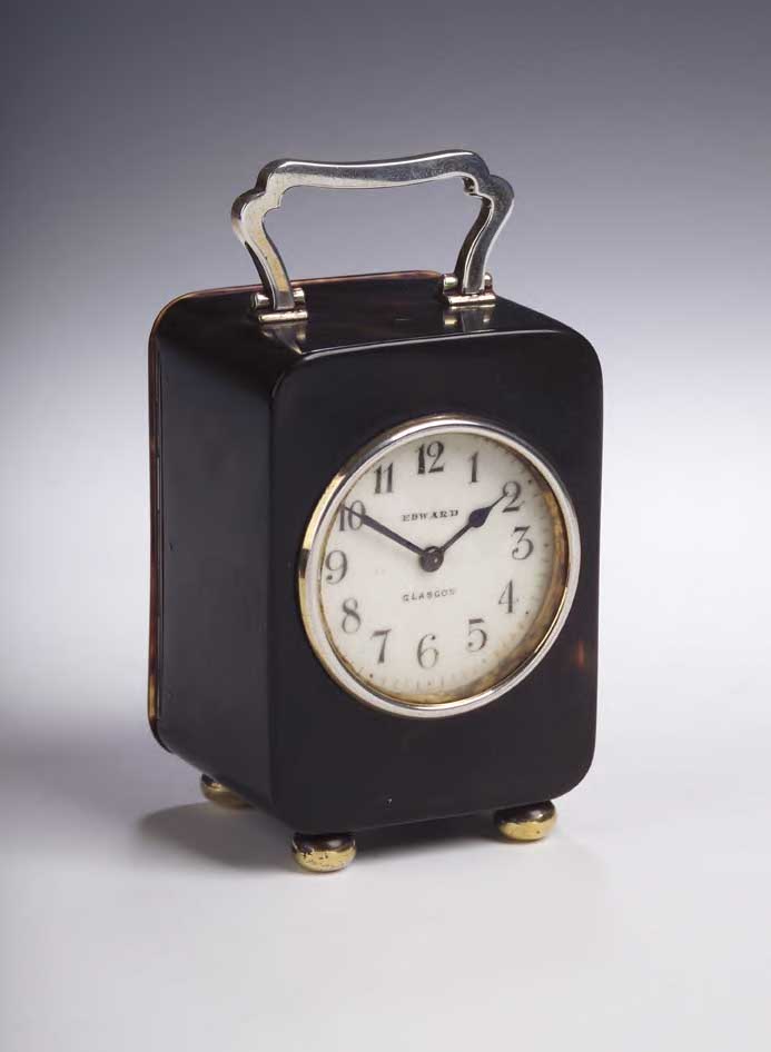 A gilt mounted tortoiseshell travelling clock,