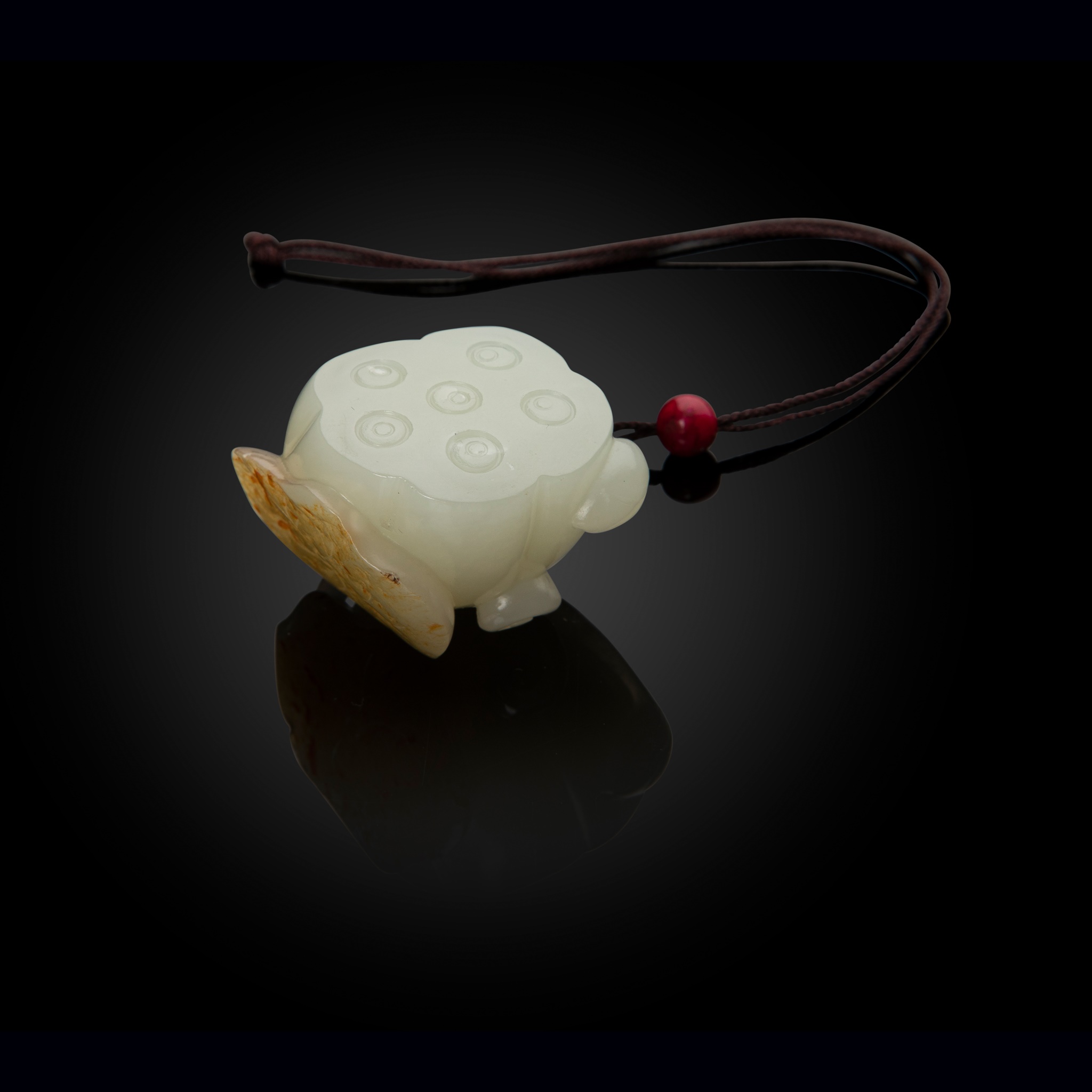 WHITE JADE WITH RUSSET SKIN 'LOTUS' PENDANT