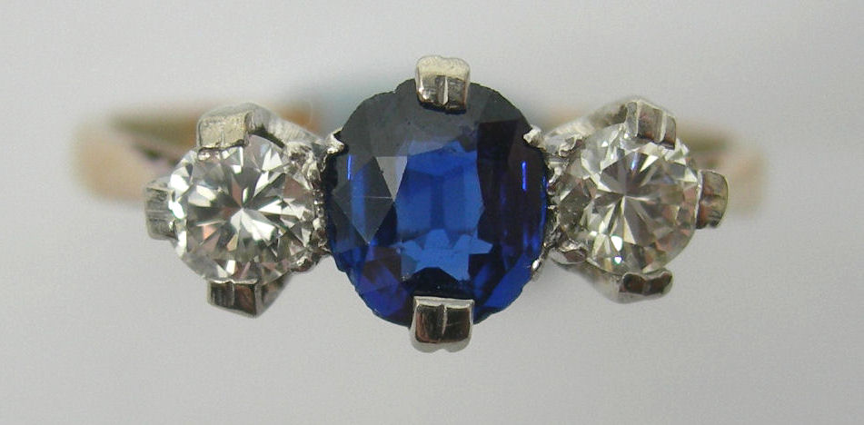 An 18ct gold mounted three-stone ring,