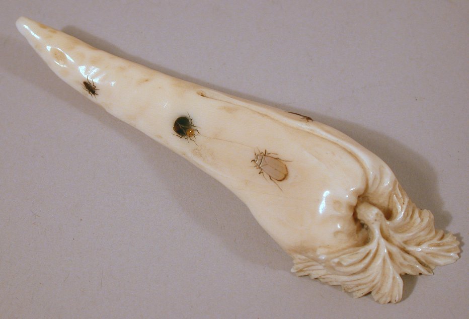 A Japanese carved ivory shibyama decorated carrot