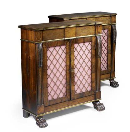 A pair of Regency rosewood and brass mounted side cabinets