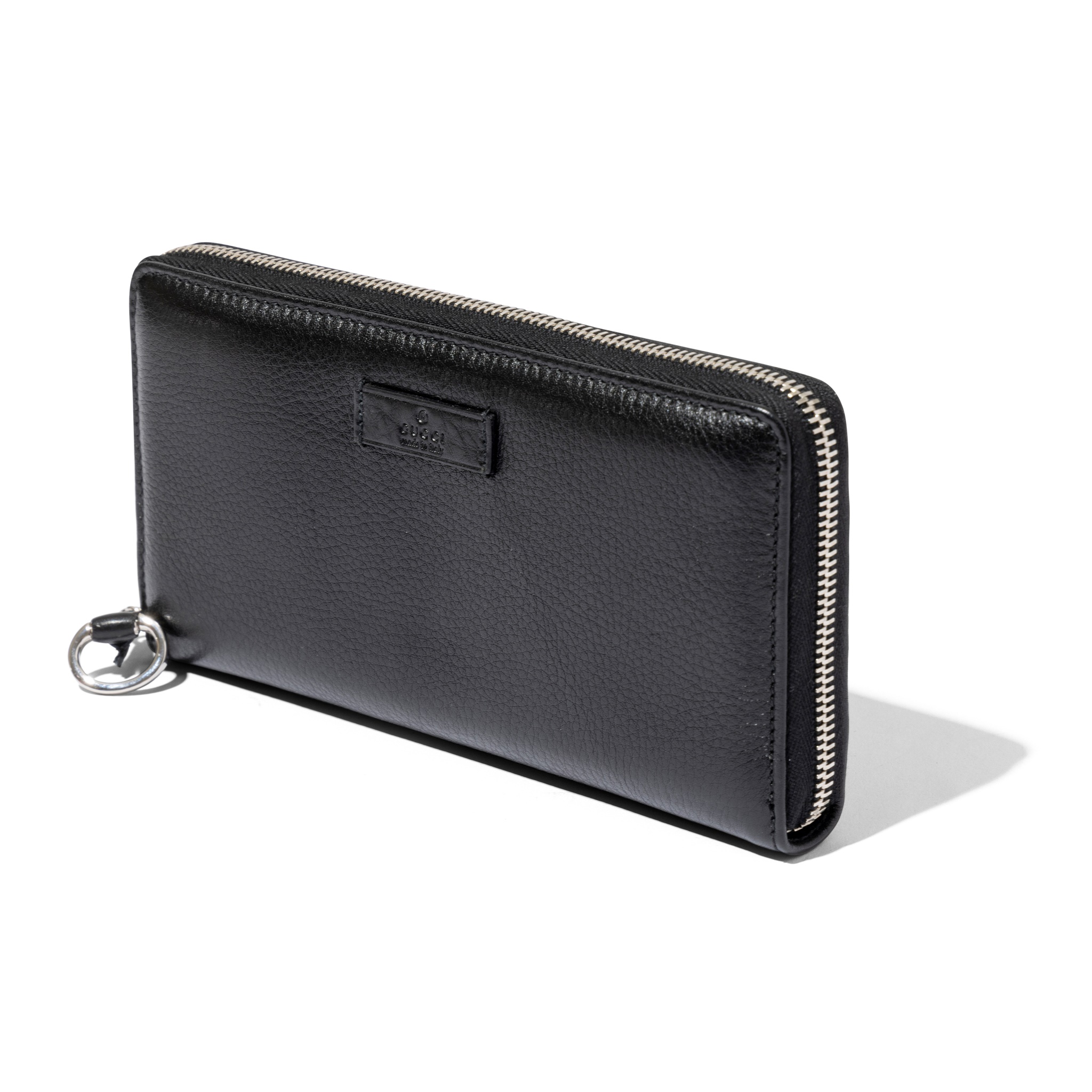 Gucci: A black leather purse
