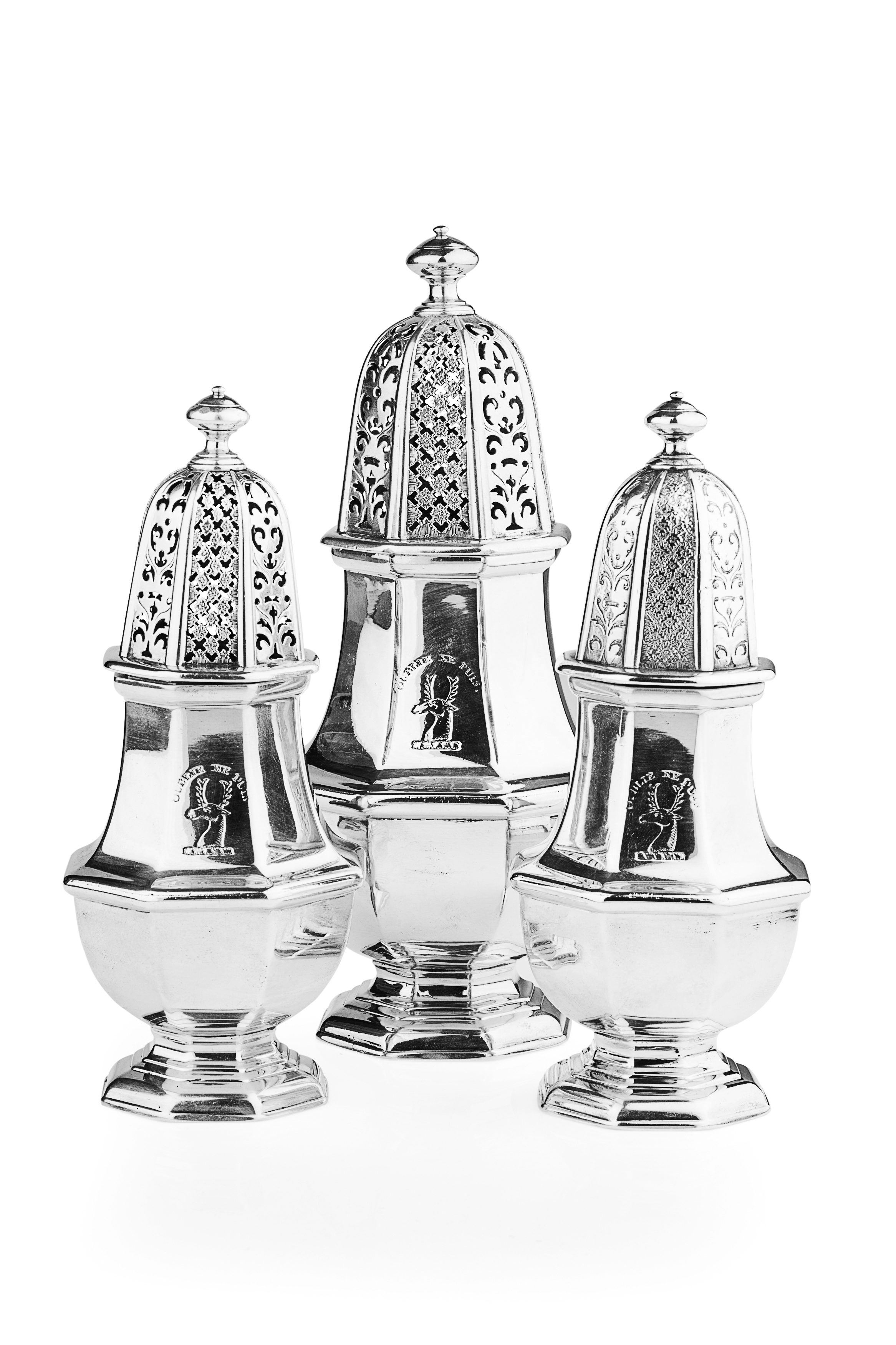 A rare set of three octagonal George II casters