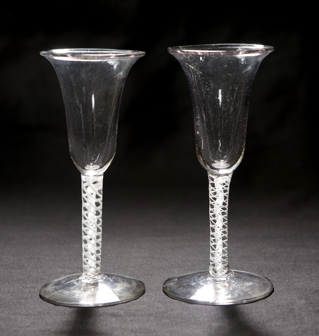 Four similar 18th century enamel twist wine glasses