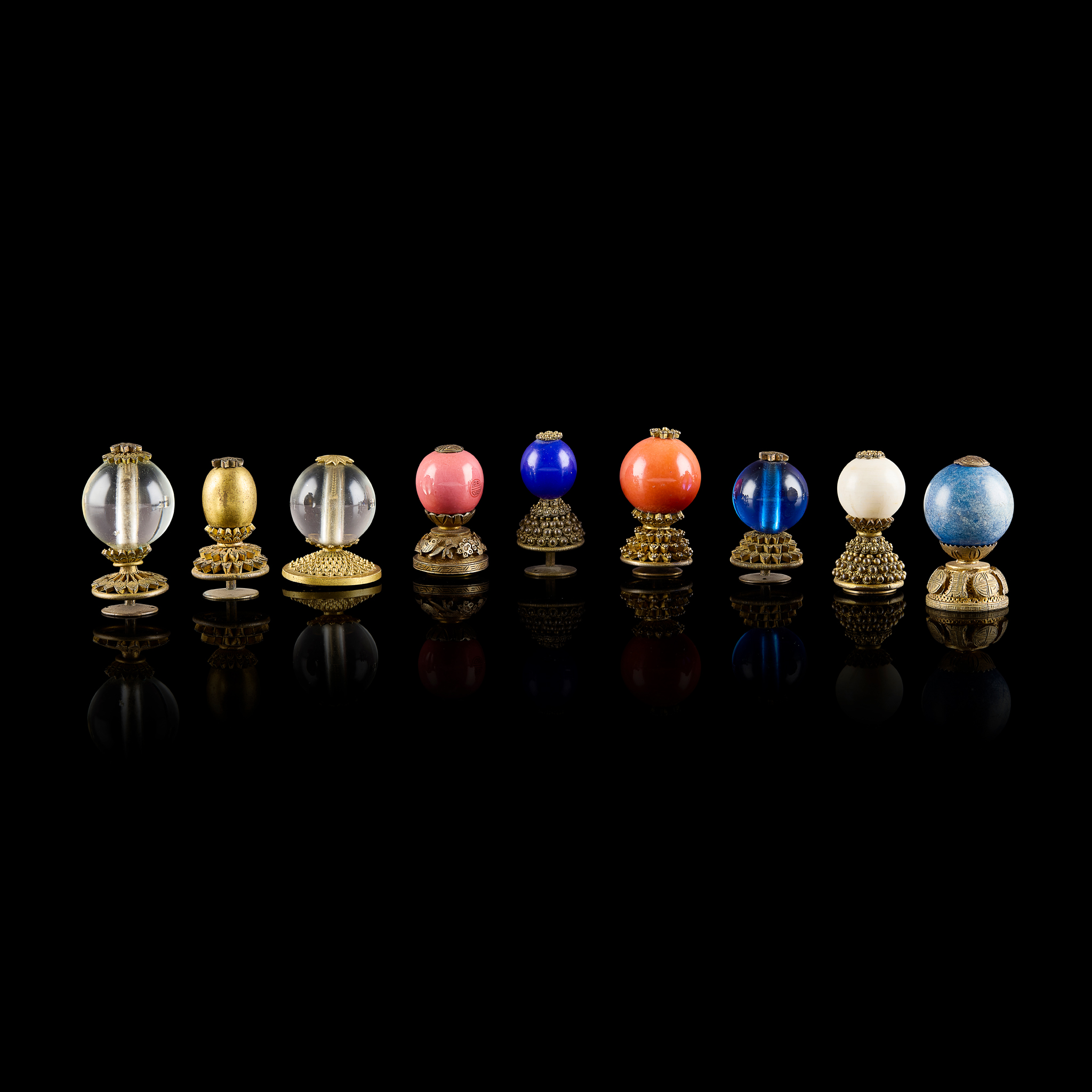 GROUP OF NINE GLASS AND GILT BRONZE "OFFICIAL'S HAT" FINIALS