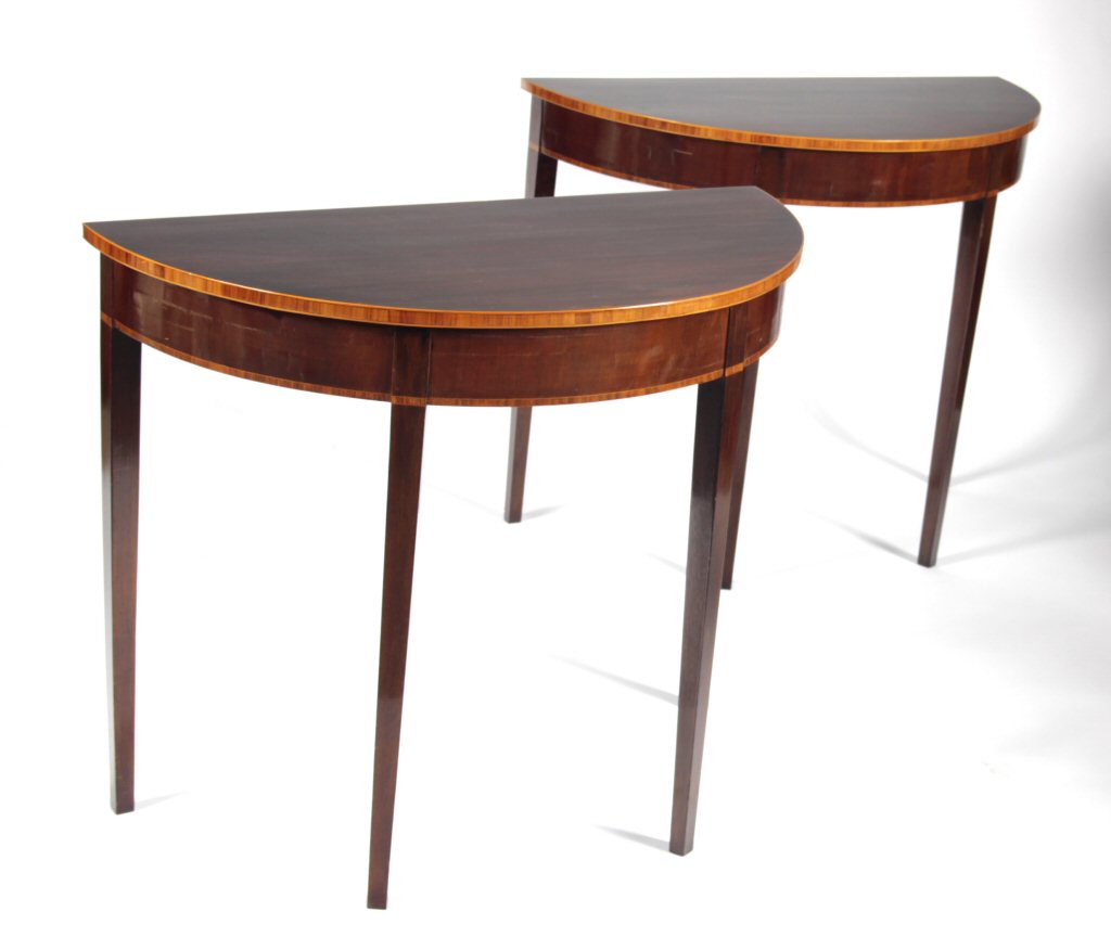 A pair of Georgian style demi-lune tables
