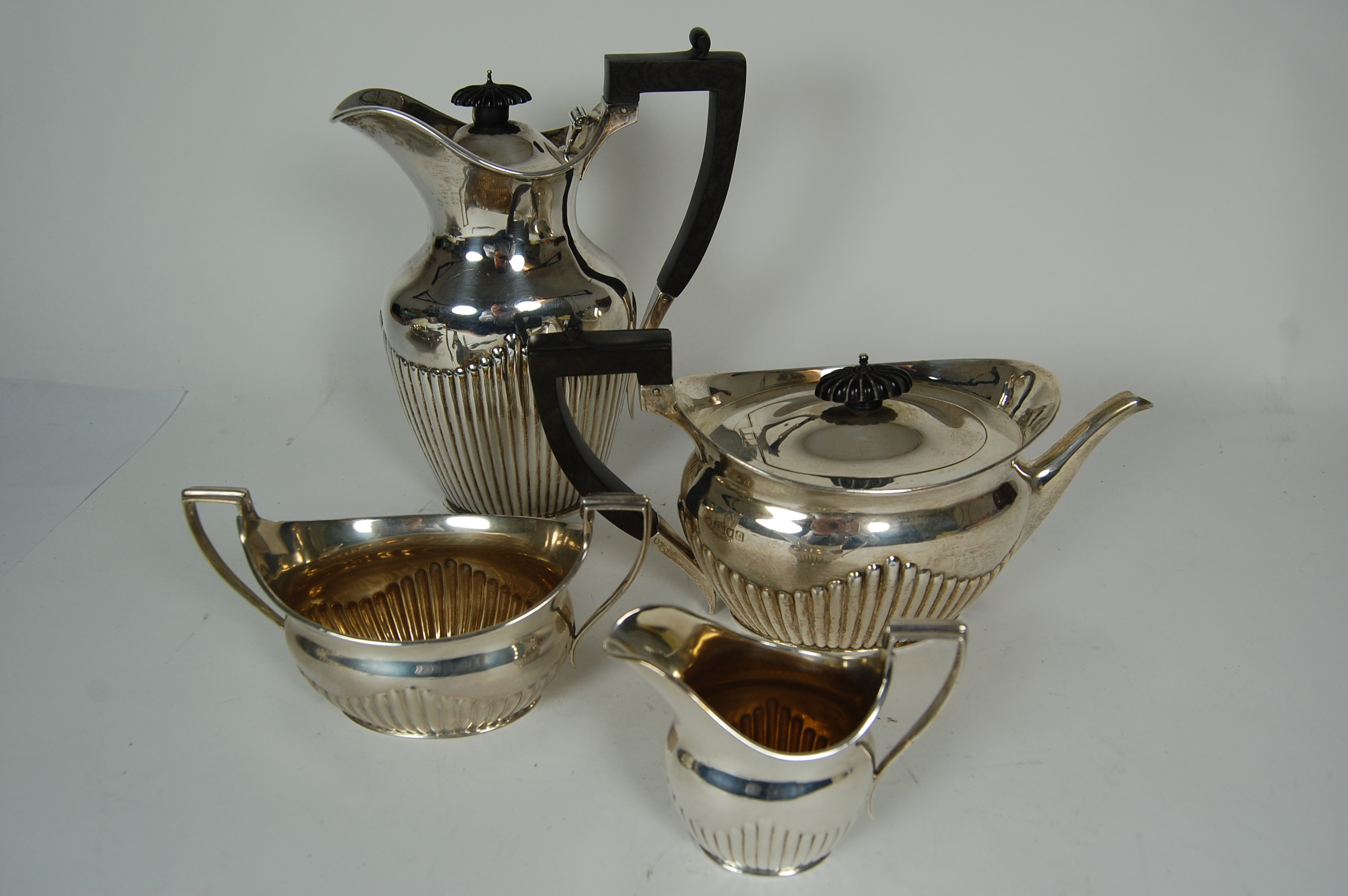 A matched four piece tea set