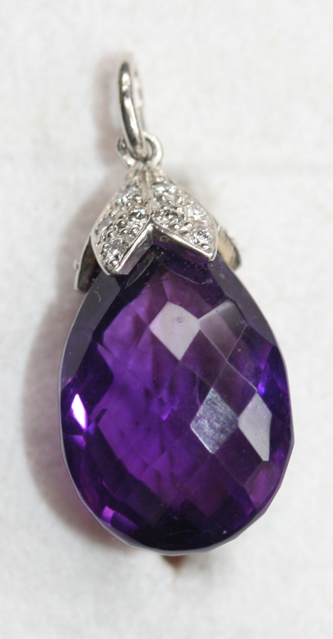 A contemporary amethyst and diamond set pendant