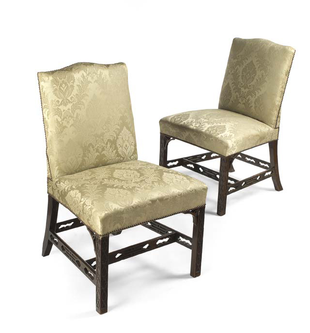 A set of six George III period mahogany framed 'Gainsborough' type drawing room chairs In the Chippendale manner