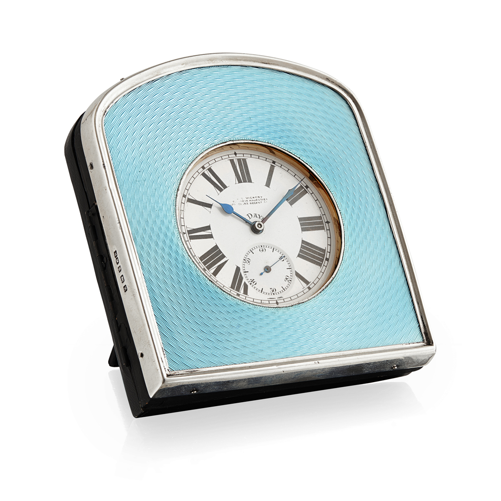 A silver and enamel cased travel watch