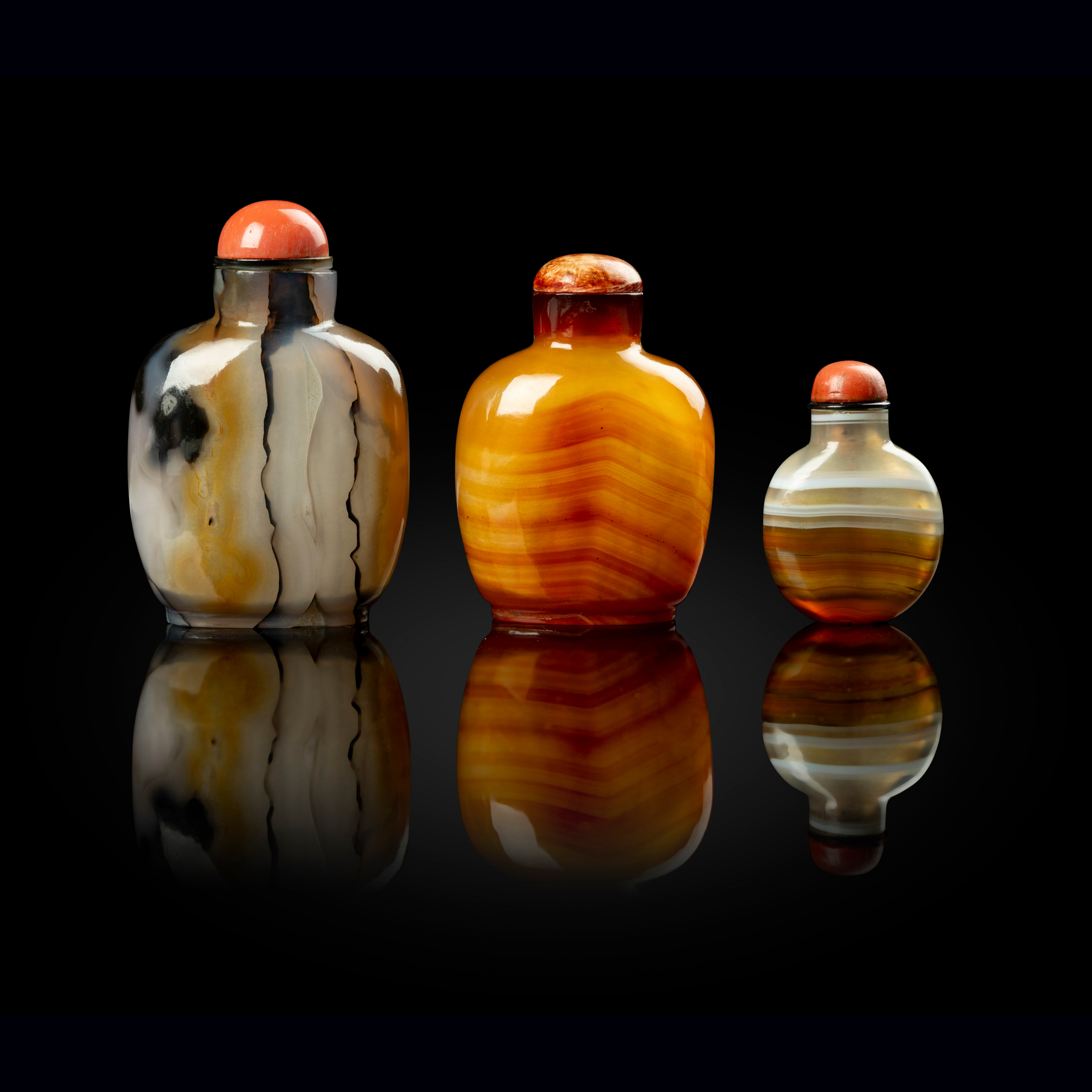 GROUP OF THREE CHINESE BANDED AGATE SNUFF BOTTLES