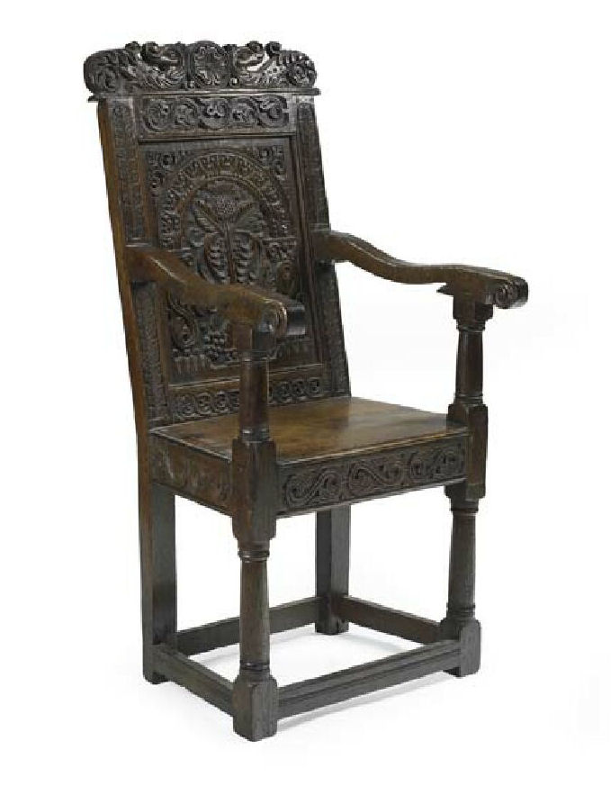 A 17th century Scottish carved and joined oak open armchair