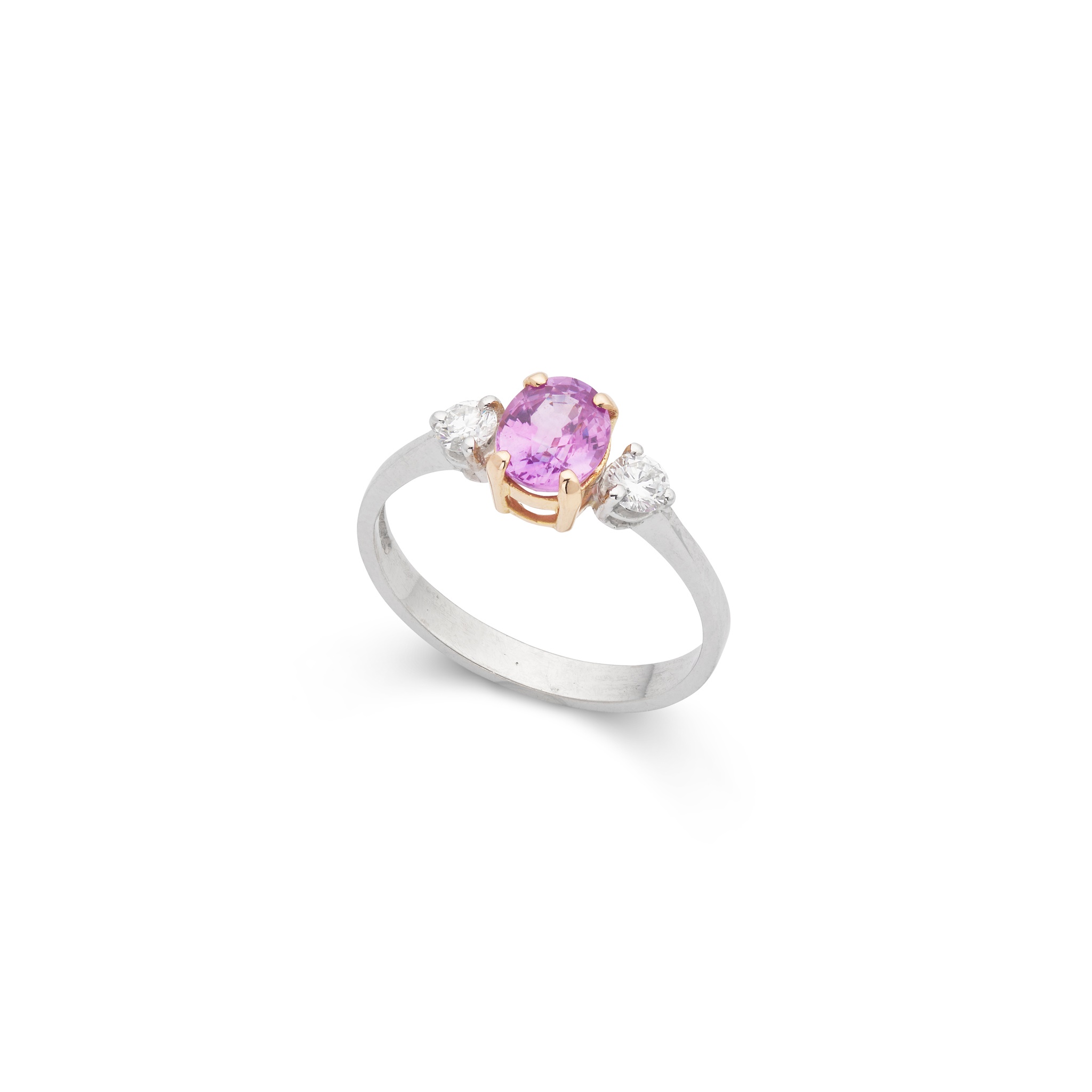 An 18ct white gold pink sapphire and diamond three-stone ring