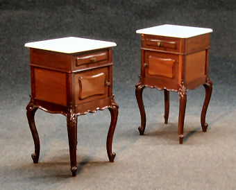 A pair of french marble top bedside cabinets in the louis xv style