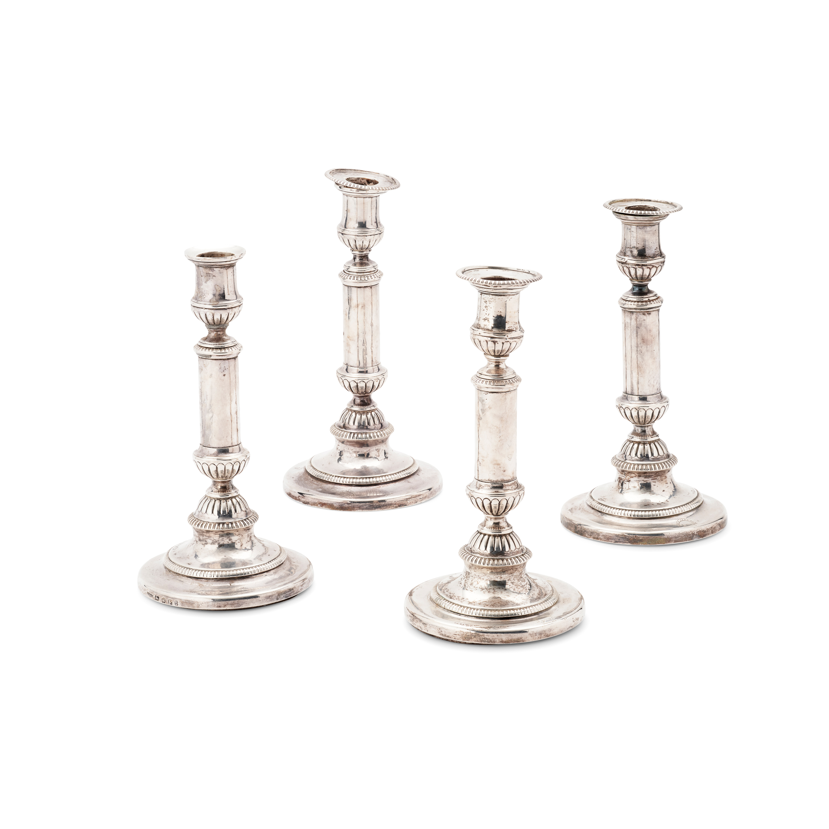 A SET OF FOUR GEORGE III TELESCOPIC CANDLESTICKS