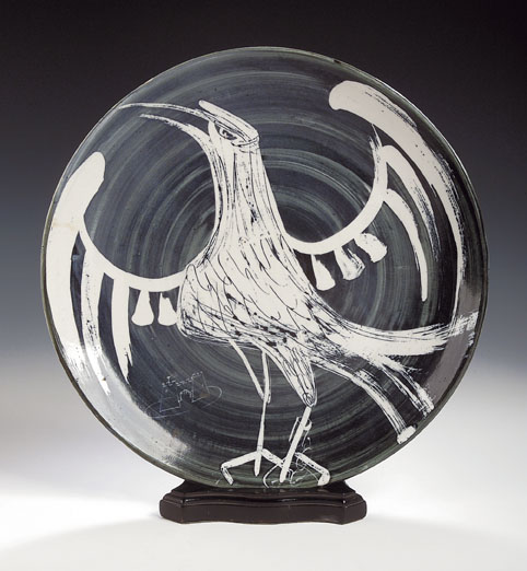 A circular pottery charger