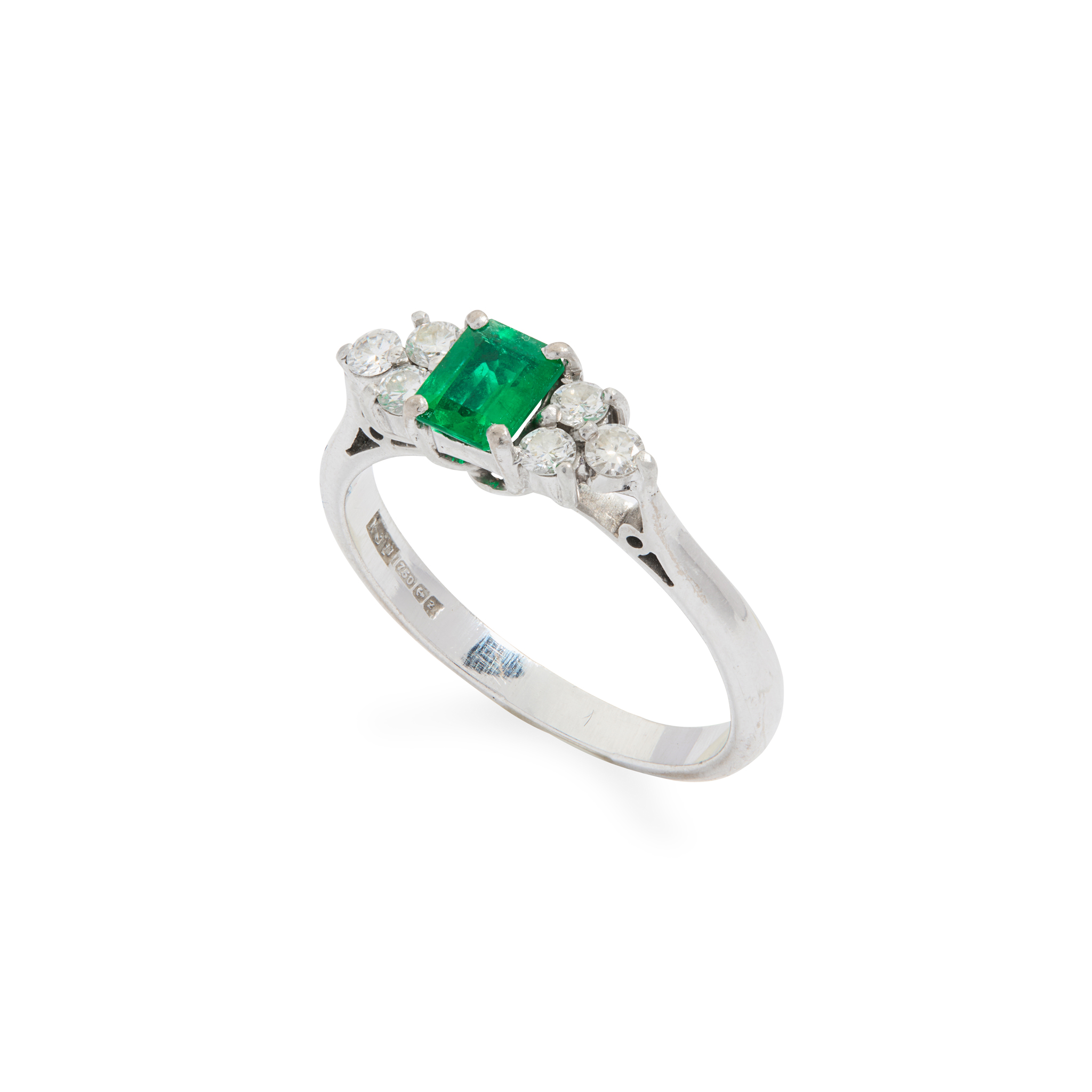 An 18ct gold emerald and diamond three-stone ring