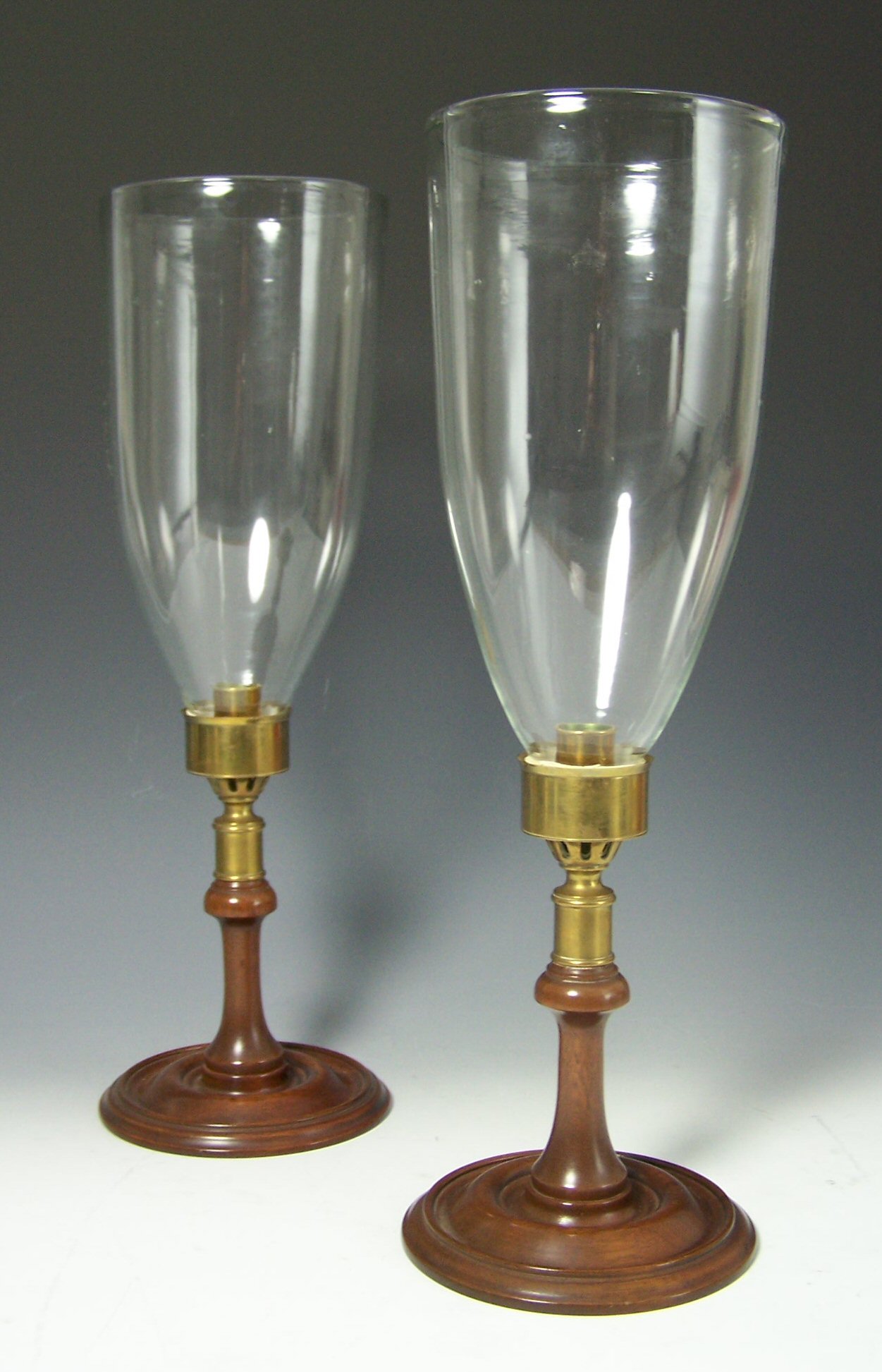 A pair of early 19th century mahogany storm lamps