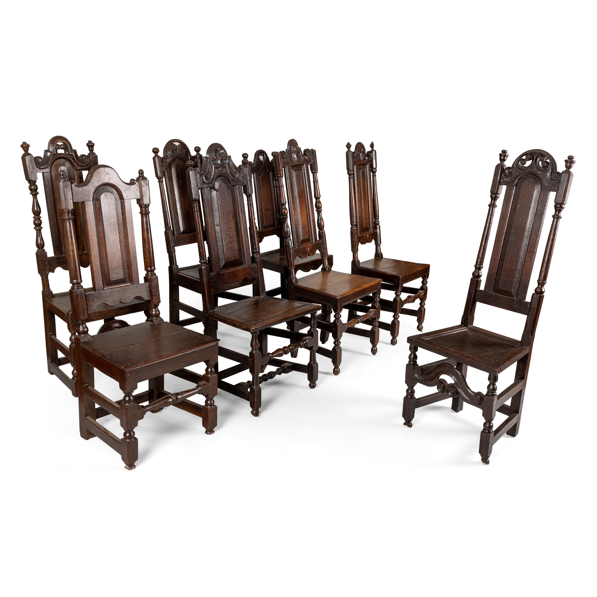 A HARLEQUIN SET OF EIGHT OAK HIGH BACK SIDE CHAIRS