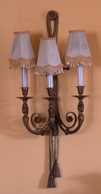 A pair of three branch gilt bronze wall lights