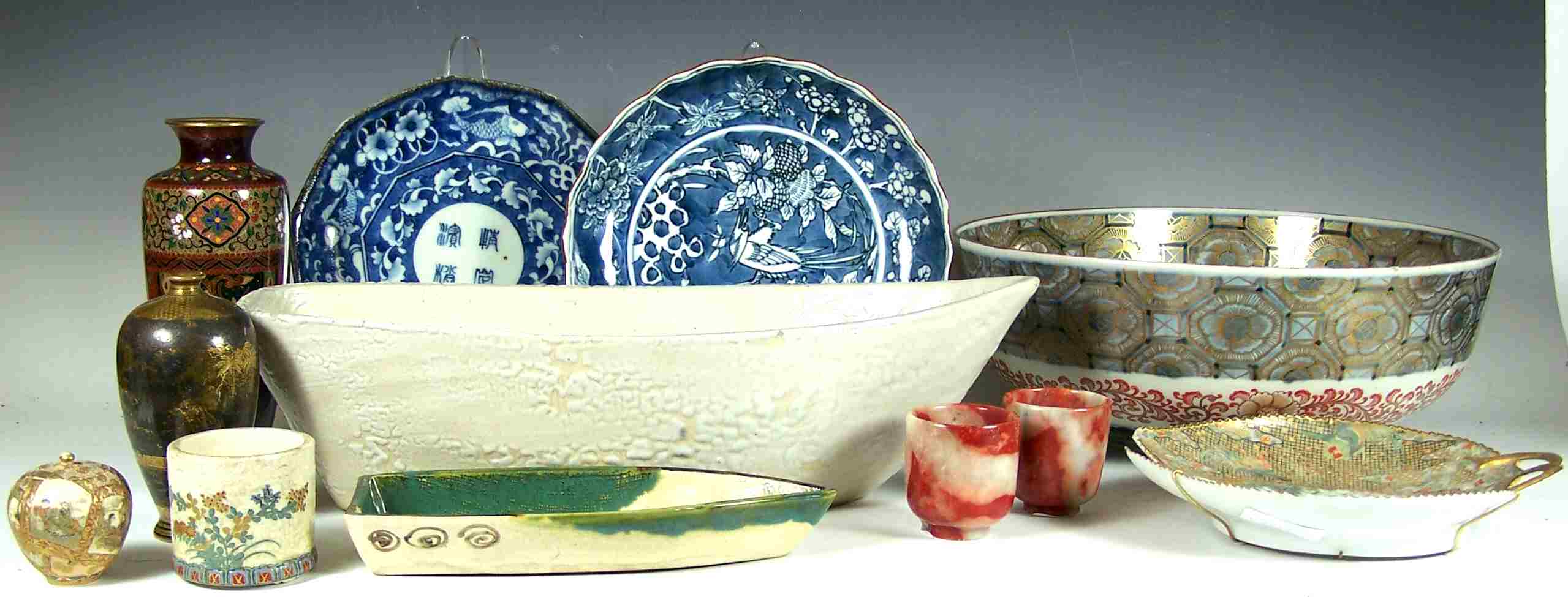 A set of nine Japanese blue painted plates,
