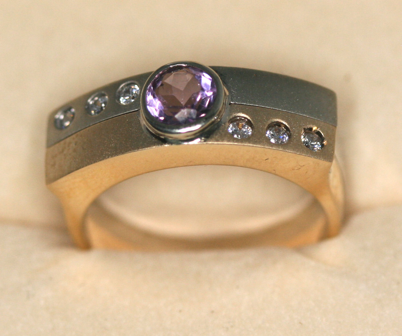 A contemporary diamond and amethyst ring