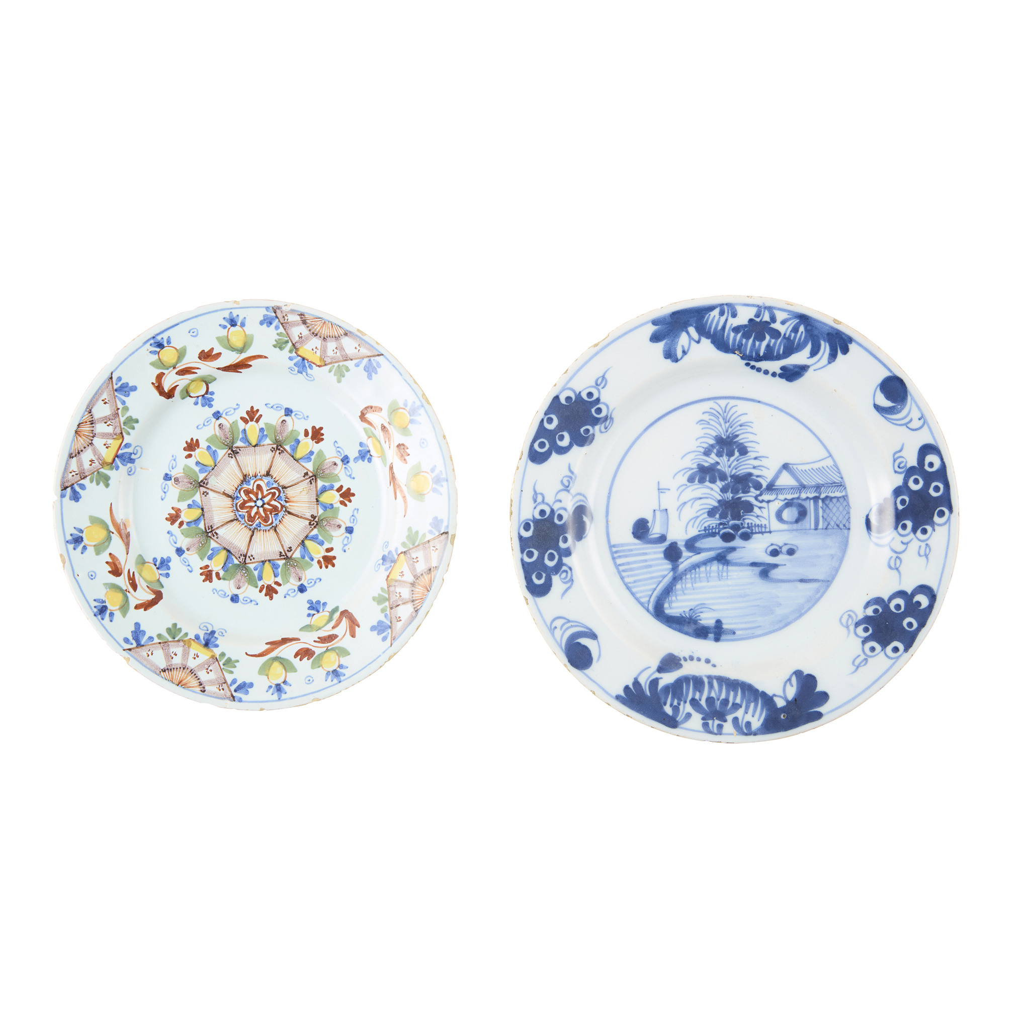 A DELFTFIELD, GLASGOW, DELFT PLATE AND AN 'ANN GOMM' TYPE POLYCHROME DELFT PLATE