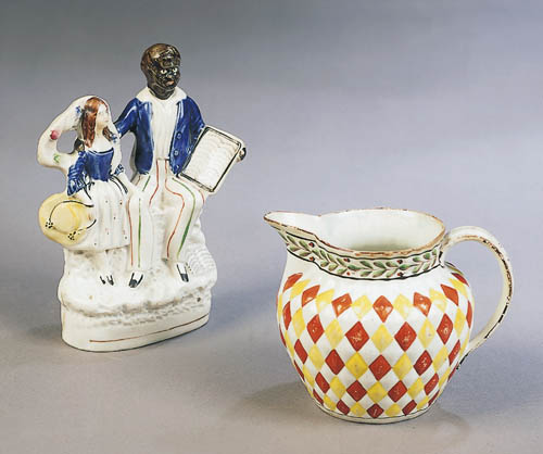 An English relief moulded Wedgwood style lozenge decorated baluster jug